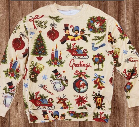 Women enjoying a festive gathering in stylish Christmas shirts.