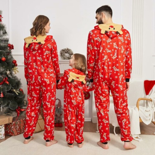 Family enjoying Christmas in matching pajamas.
