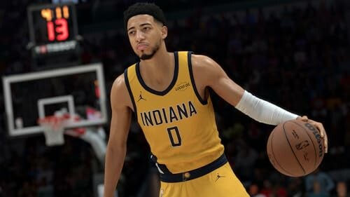 Basketball player in Indiana jersey holding a basketball.