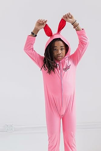 Child wearing a pink bunny costume with ears raised.
