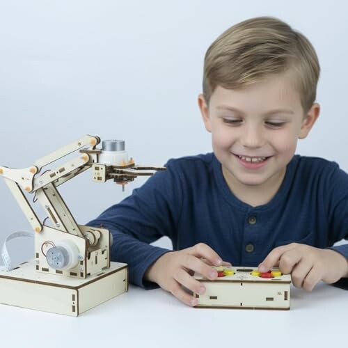 Child playing with a robotic arm