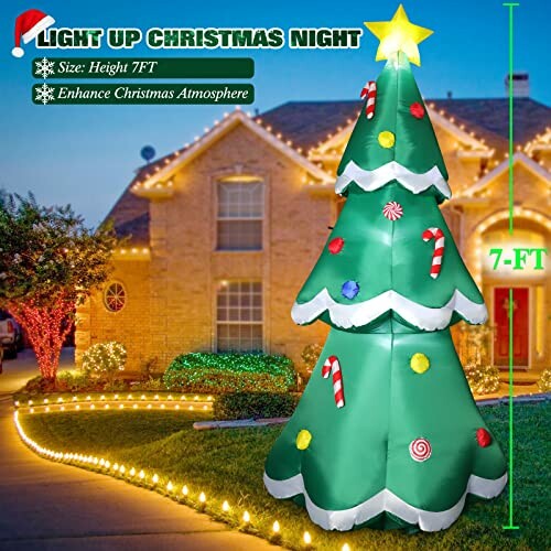 Inflatable Christmas tree decoration with lights in a yard.