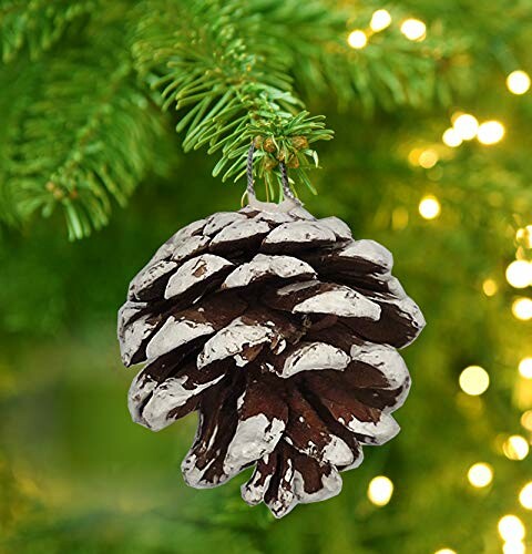 Pine cone ornament hanging on a Christmas tree