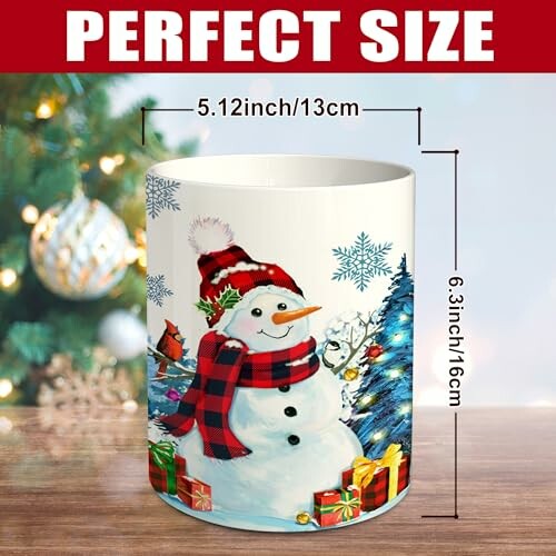 Festive mug with snowman, gifts, and Christmas tree design
