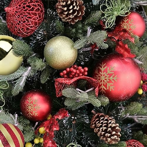 Close-up of a decorated Christmas tree with ornaments and pine cones.