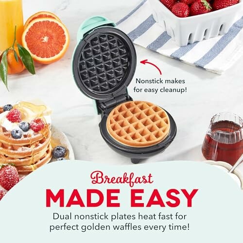 Compact waffle maker with freshly made waffle, surrounded by breakfast items like fruit and juice.