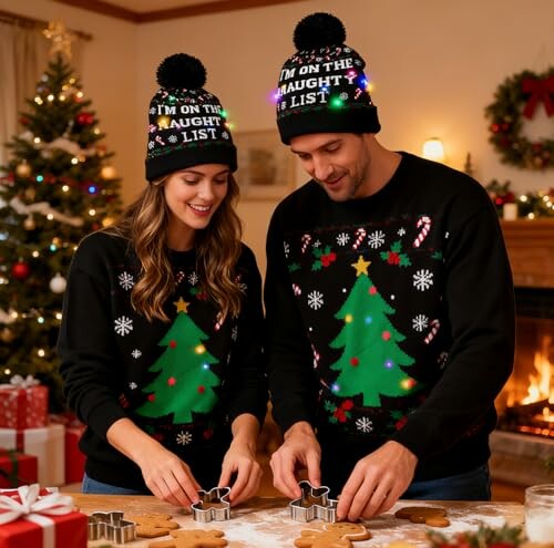 Couple in matching Christmas sweaters and hats baking cookies.