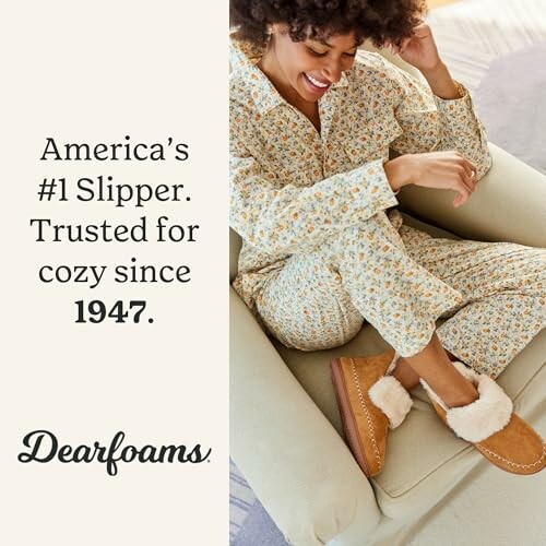 Woman wearing cozy slippers and pajamas, smiling on a chair.