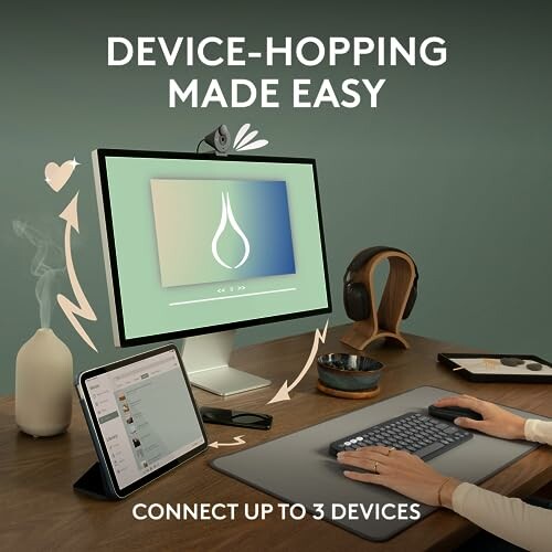 Workstation with monitor, tablet, and keyboard for easy device switching.