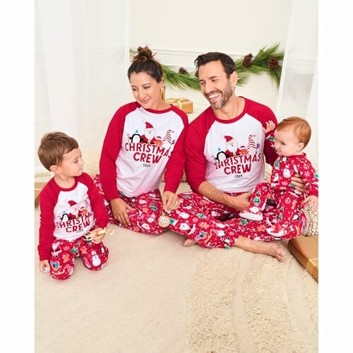 Family in matching Christmas pajamas sitting together.