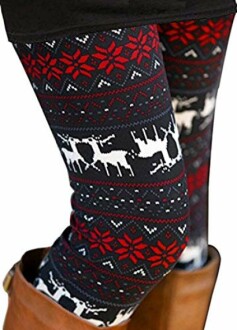 Close-up of leggings with red snowflakes and white reindeer pattern.