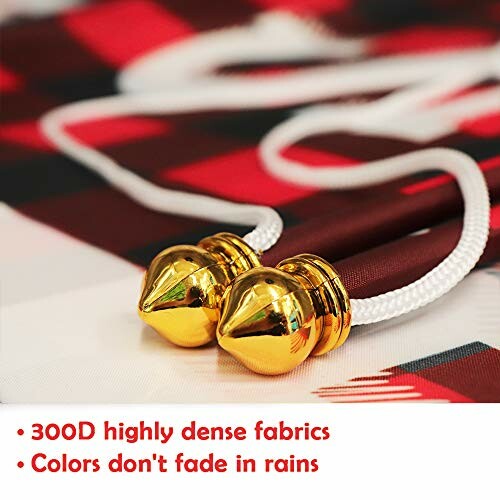 Close-up of a flag with gold tassels and text about fabric quality.