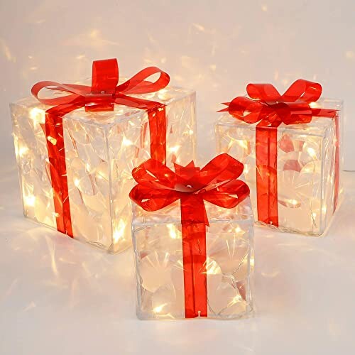 Three glowing gift boxes with red ribbons.