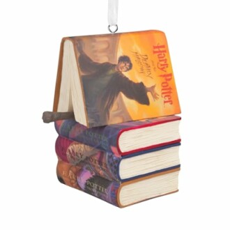Ornament shaped like stacked Harry Potter books with a wand.