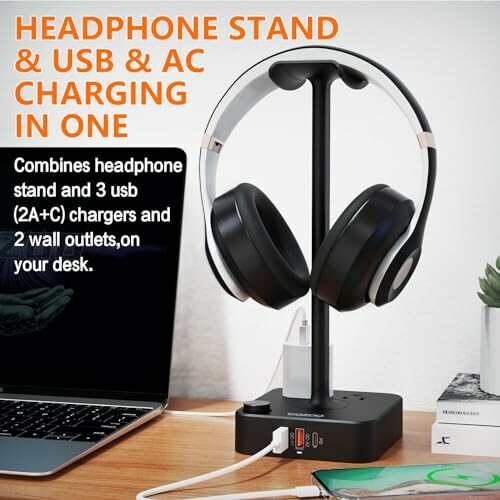 Headphone stand with USB and AC charging ports on desk.
