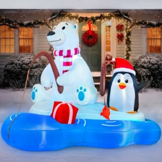 Inflatable polar bear and penguin on ice with fishing rod and gift box.