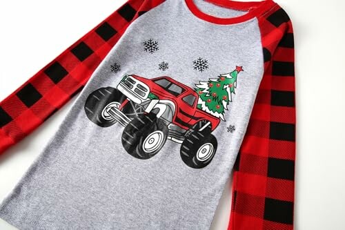 Kids Christmas shirt with monster truck and tree design.