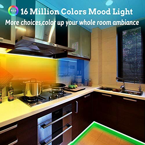 Modern kitchen with colorful mood lighting.