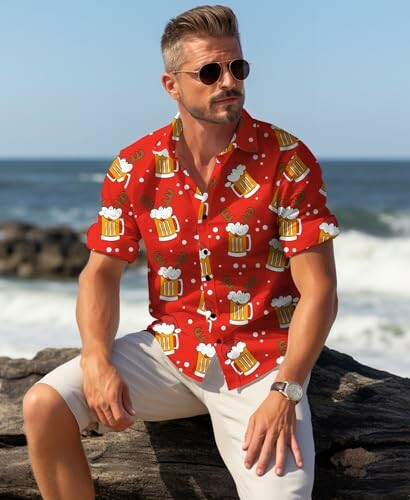 Man wearing a red beer-themed shirt at the beach.