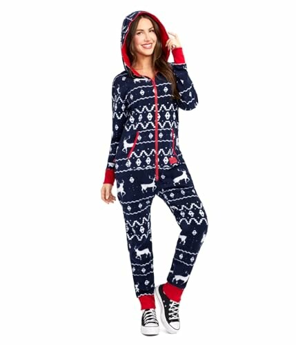 Person wearing a navy Christmas onesie with white deer and snowflake patterns