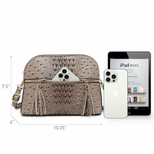 Ostrich leather handbag with smartphone and iPad mini for size comparison.