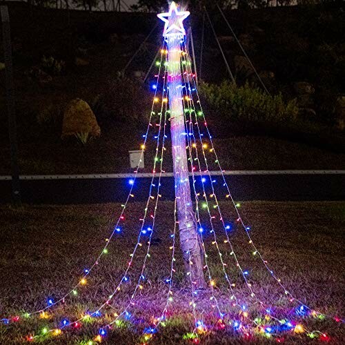 Outdoor spiral Christmas lights with star topper on a tree frame.