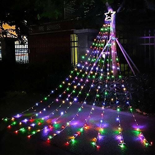 Colorful outdoor Christmas tree lights with star topper.