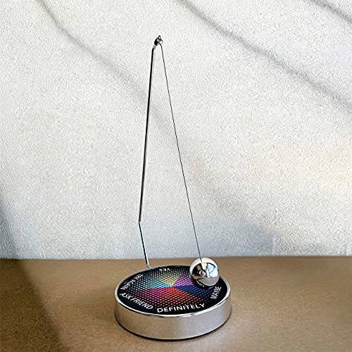 Magnetic Decision Maker Swing Pendulum on a textured surface