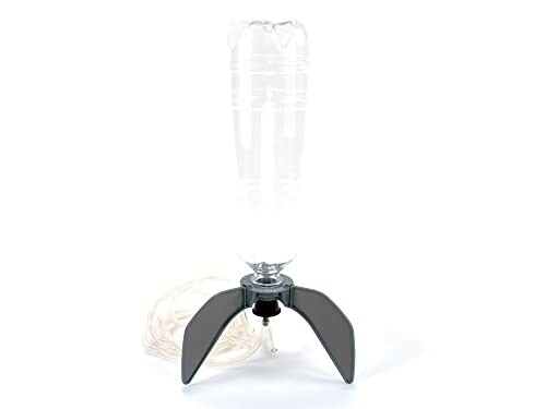 Plastic bottle rocket launcher with fins and tube.