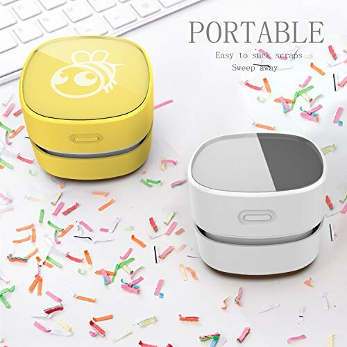 Portable mini vacuum cleaners with colorful confetti.