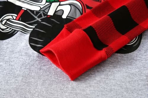Red sleeve on gray fabric with motorcycle print