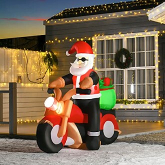 Inflatable Santa Claus on a motorcycle with Christmas lights.