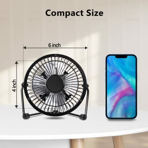 Compact 6-inch desk fan next to smartphone for size comparison