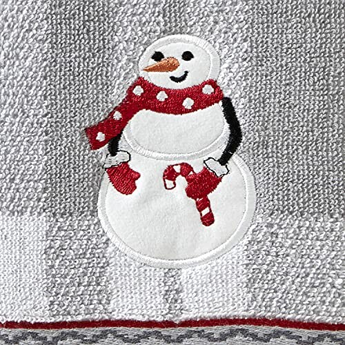 Towel with embroidered snowman wearing a red scarf and mittens.