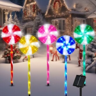 Solar candy cane lights in snowy holiday setting.