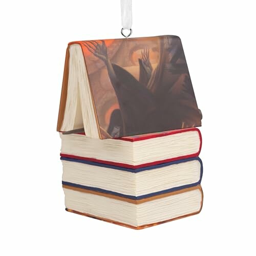 Ornament shaped like stacked books with an open book on top.