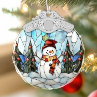 Stained glass ornament depicting a snowman with trees.