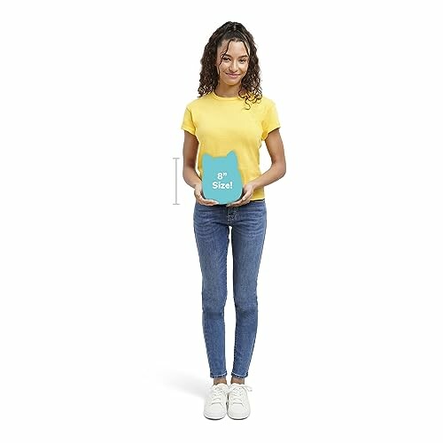 Woman in yellow shirt holding a blue container.