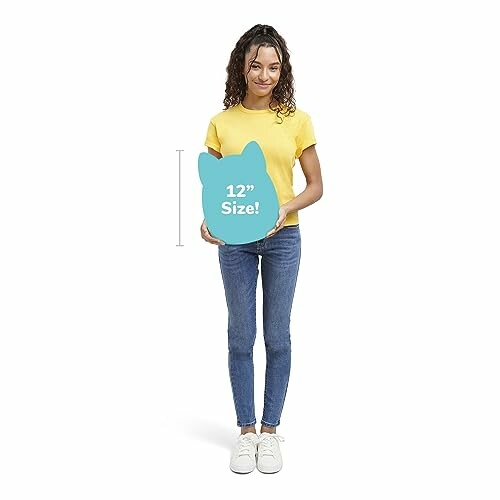 Woman in yellow shirt holding a 12-inch blue cushion, representing plush toys' cuddly nature.