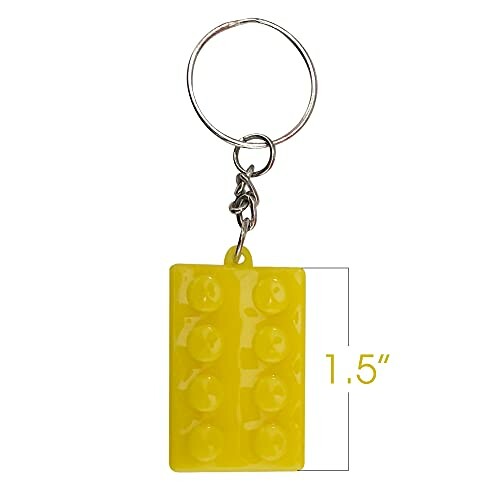 Yellow brick-shaped keychain with dimensions.